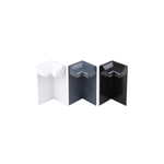 A white, an anthracite grey, and a black external edge trim corner, standing upright to emphasise their shape and colour.